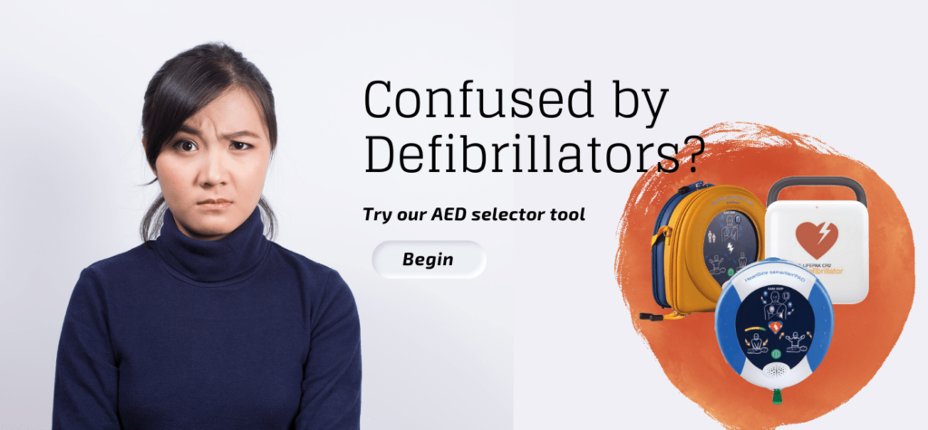 A lady is confused when looking at defibrillators