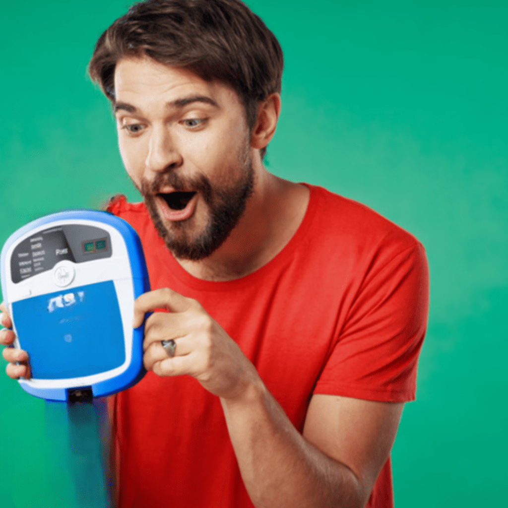 a man is excited to hold an aed